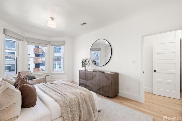 bedroom with light hardwood / wood-style flooring