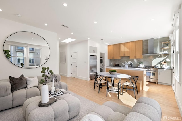 living room with light hardwood / wood-style flooring