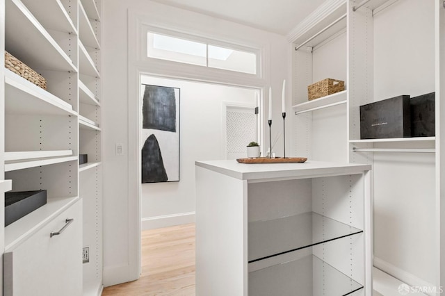 spacious closet featuring light hardwood / wood-style floors