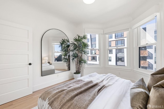 bedroom with light wood-type flooring