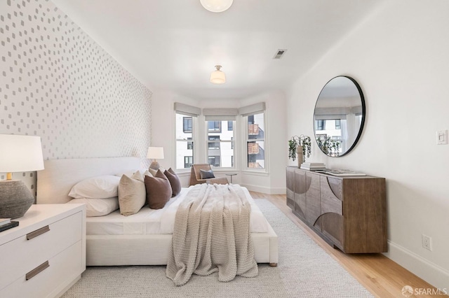 bedroom with light hardwood / wood-style flooring