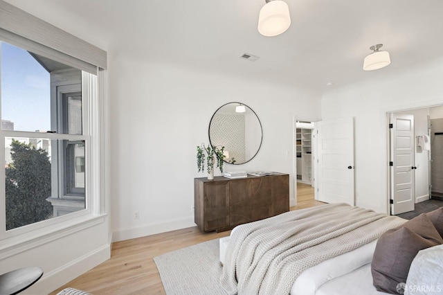 bedroom with light wood-type flooring