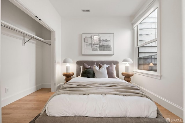 bedroom featuring hardwood / wood-style flooring