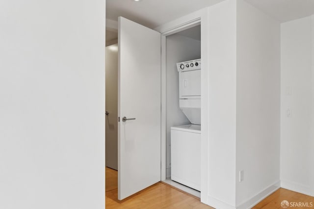 301 Mission St Unit 16H, San Francisco, CA 94105 - laundry room with estacked washer and dryer and light wood-type flooring