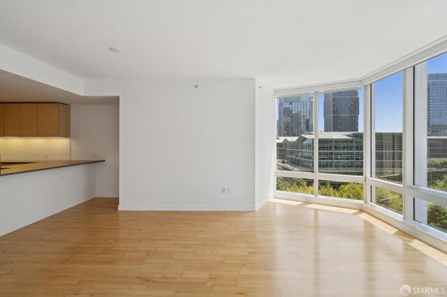 301 Mission St Unit 16H, San Francisco, CA 94105 - unfurnished living room with light wood finished floors