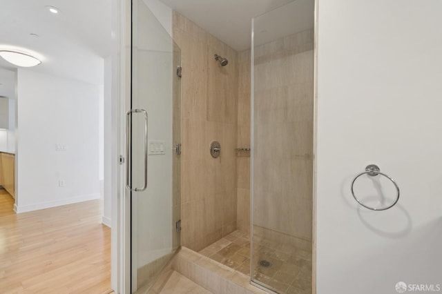 301 Mission St Unit 16H, San Francisco, CA 94105 - bathroom featuring a stall shower and wood finished floors