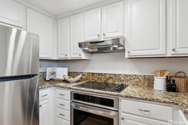 kitchen featuring stainless steel appliances, white cabinets, and stone countertops