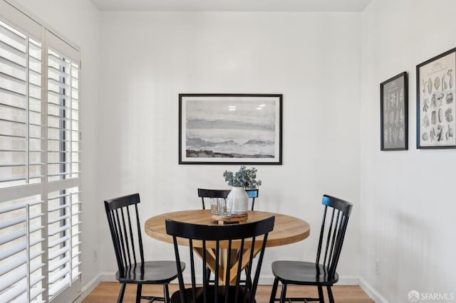 dining space with light wood-type flooring