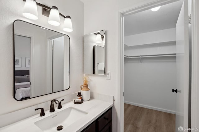 bathroom with vanity and hardwood / wood-style flooring