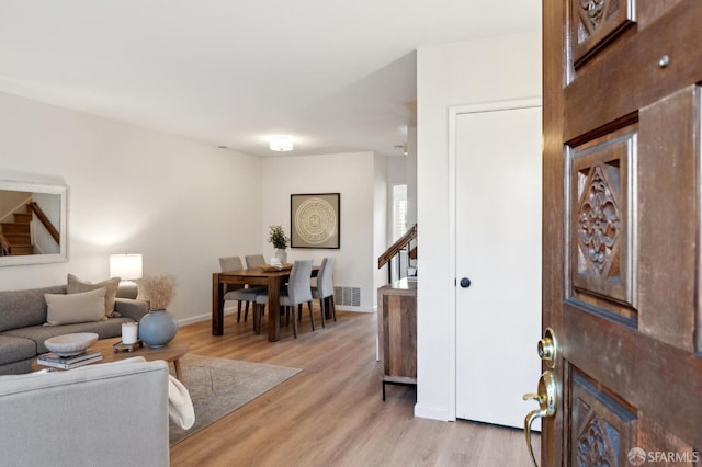 living room with light hardwood / wood-style flooring