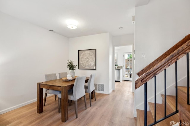 dining space featuring light hardwood / wood-style floors