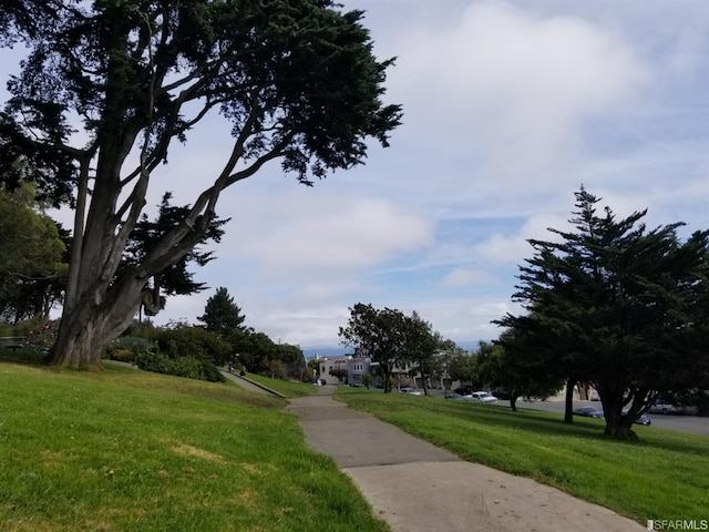 view of home's community featuring a lawn