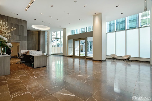 338 Main St Unit 19G, San Francisco, CA 94105 - building lobby with a high ceiling and floor to ceiling windows