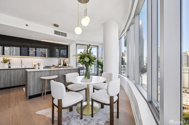 338 Main St Unit 19G, San Francisco, CA 94105 - dining space featuring light wood finished floors