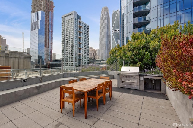 338 Main St Unit 19G, San Francisco, CA 94105 - view of patio / terrace featuring exterior kitchen, a skyline view, and outdoor dining area