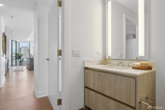 338 Main St Unit 19G, San Francisco, CA 94105 - bathroom with wood finished floors, vanity, and recessed lighting