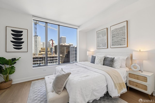 338 Main St Unit 19G, San Francisco, CA 94105 - bedroom with wood finished floors and a view of skyline