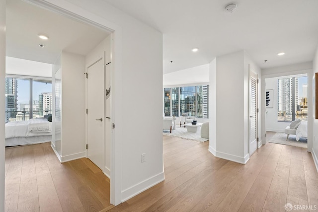 338 Main St Unit 19G, San Francisco, CA 94105 - hall featuring a view of city, hardwood / wood-style flooring, and recessed lighting