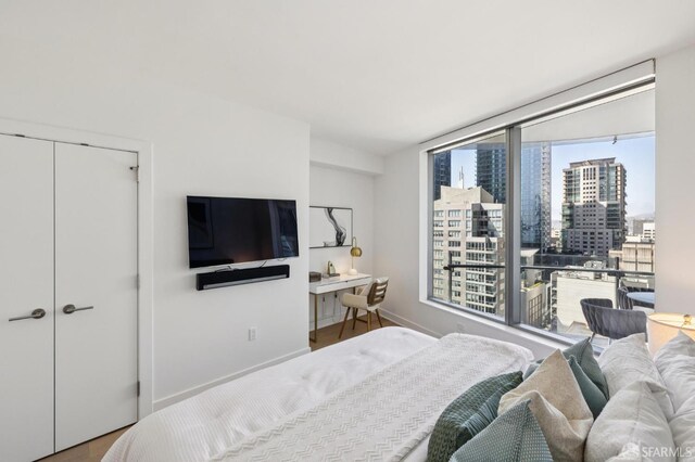 338 Main St Unit 19G, San Francisco, CA 94105 - bedroom featuring wood finished floors and baseboards