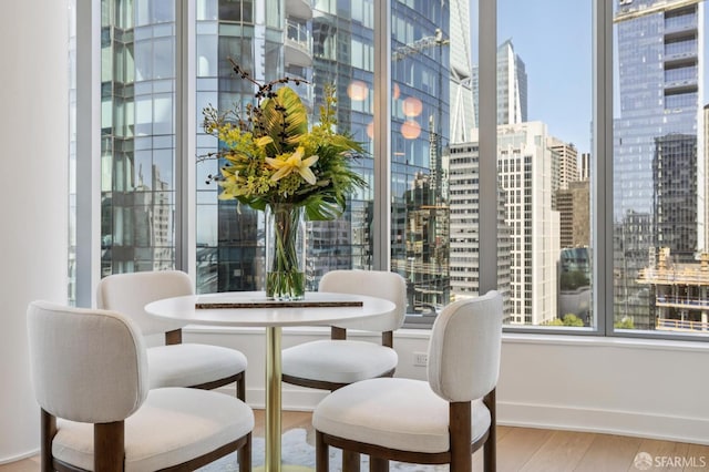 338 Main St Unit 19G, San Francisco, CA 94105 - dining space with a city view and wood finished floors