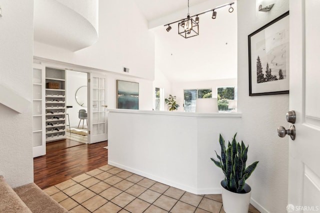 interior space featuring a chandelier and vaulted ceiling