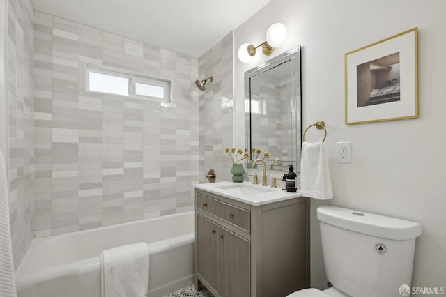 bathroom with toilet, vanity, and shower / bathtub combination