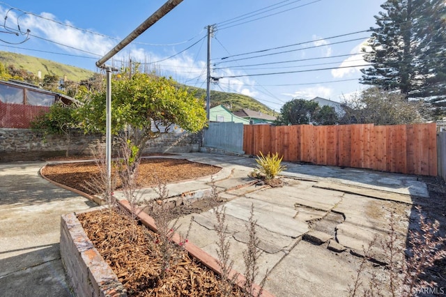 view of yard featuring a patio area and fence