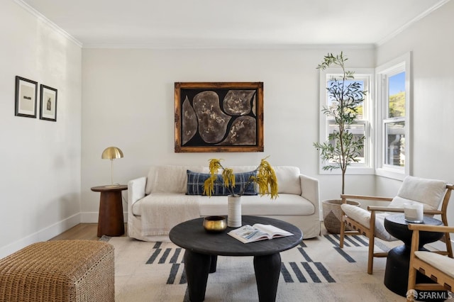 sitting room featuring crown molding and baseboards