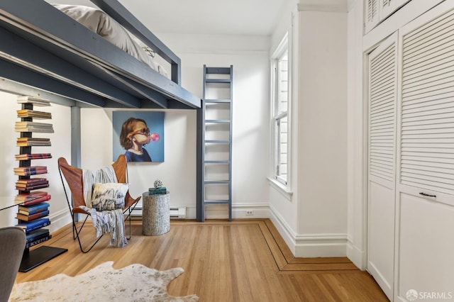 mudroom featuring light wood-type flooring and baseboards