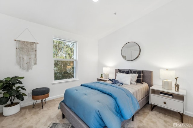 carpeted bedroom featuring baseboards