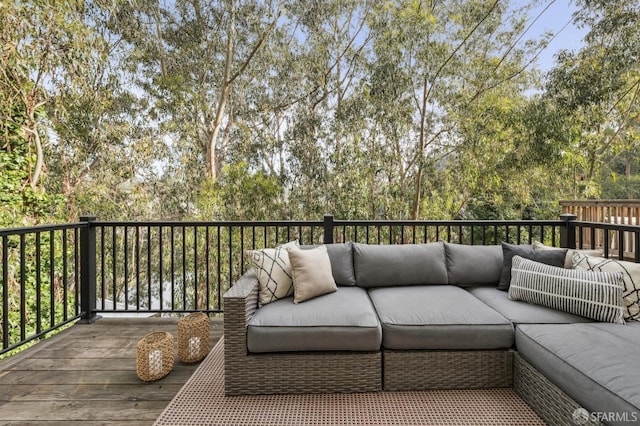 wooden terrace with outdoor lounge area