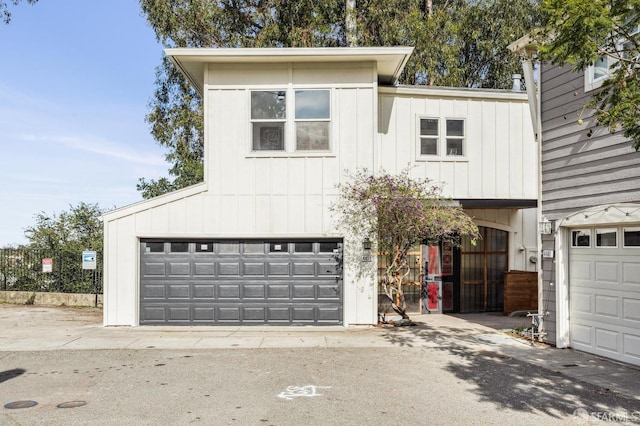 view of front of house with board and batten siding and an attached garage