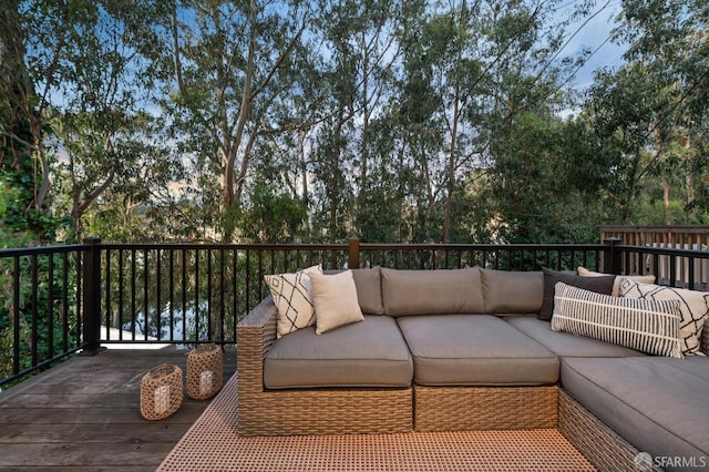 wooden terrace with an outdoor hangout area