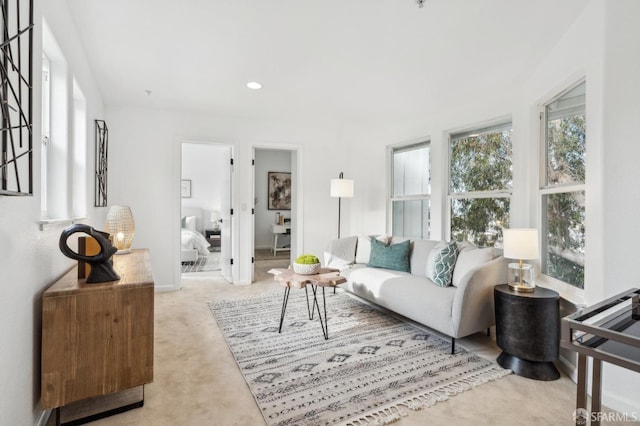 living area with carpet flooring and recessed lighting