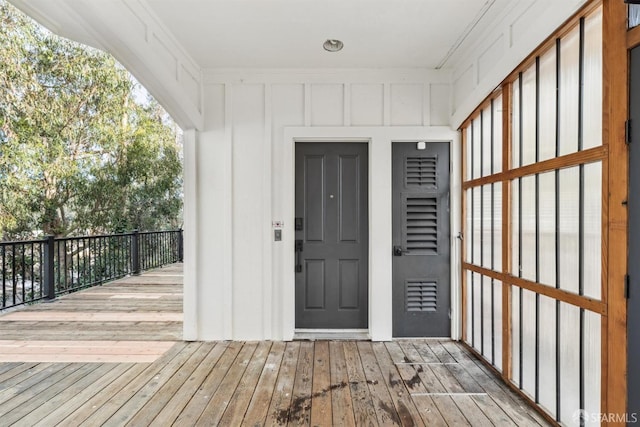 view of exterior entry featuring board and batten siding