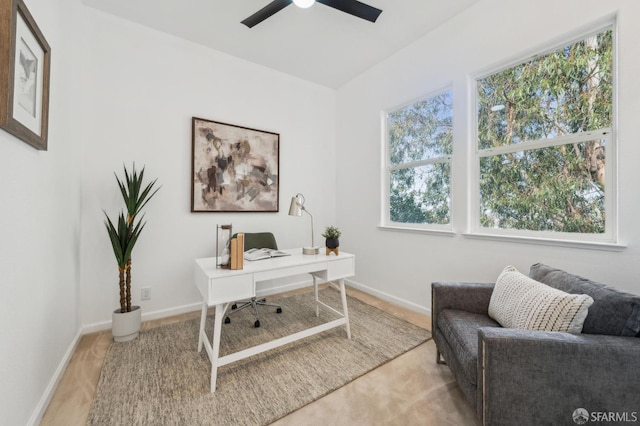 home office featuring ceiling fan and baseboards