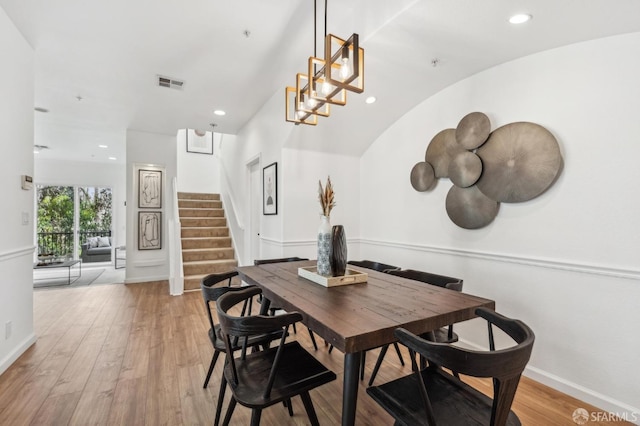 dining space featuring baseboards, visible vents, stairway, light wood-style floors, and recessed lighting