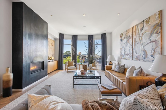 living room with a warm lit fireplace