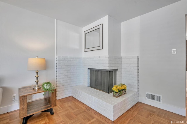 details with visible vents, a fireplace, and baseboards