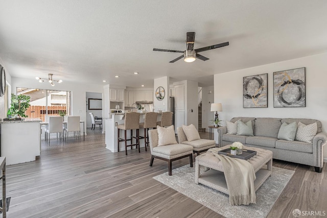 4156 N Amargosa Dr N, Antioch, CA 94531 - living area featuring light wood-style flooring, a ceiling fan, a chandelier, and recessed lighting