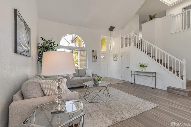 4156 N Amargosa Dr N, Antioch, CA 94531 - living area featuring high vaulted ceiling, stairway, and wood finished floors