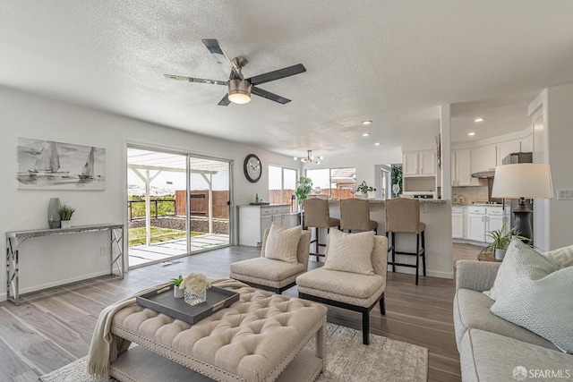 4156 N Amargosa Dr N, Antioch, CA 94531 - living room with ceiling fan, recessed lighting, a chandelier, a textured ceiling, and wood finished floors
