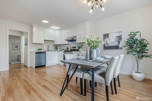 1567 44th Ave, San Francisco, CA 94122 - dining room with a chandelier and light wood finished floors