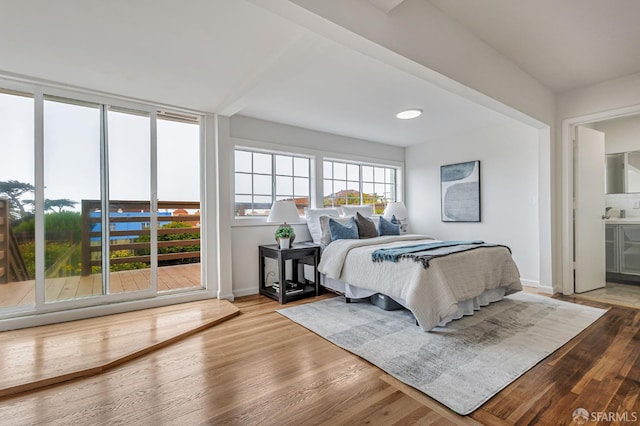 1567 44th Ave, San Francisco, CA 94122 - bedroom featuring wood finished floors and ensuite bathroom
