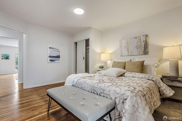 1567 44th Ave, San Francisco, CA 94122 - bedroom featuring crown molding, wood finished floors, and a closet