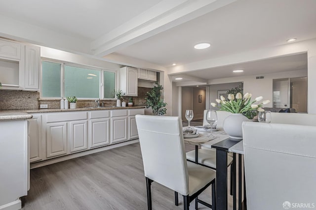 1567 44th Ave, San Francisco, CA 94122 - dining space featuring light wood-type flooring, beam ceiling, and recessed lighting