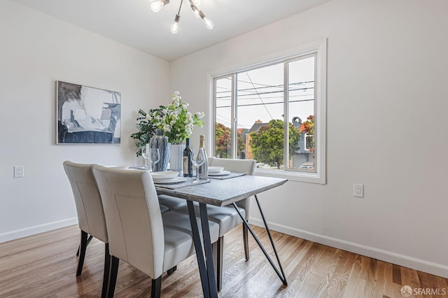 1567 44th Ave, San Francisco, CA 94122 - dining space featuring wood finished floors and a chandelier