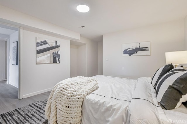 1567 44th Ave, San Francisco, CA 94122 - bedroom featuring wood finished floors and baseboards