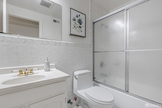 1567 44th Ave, San Francisco, CA 94122 - full bathroom featuring vanity, enclosed tub / shower combo, and tile walls