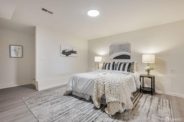 1567 44th Ave, San Francisco, CA 94122 - bedroom featuring wood finished floors and baseboards